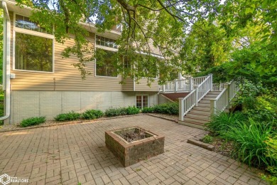 Nestled on over an acre on a scenic private drive, this on Highland Park Golf Course in Iowa - for sale on GolfHomes.com, golf home, golf lot