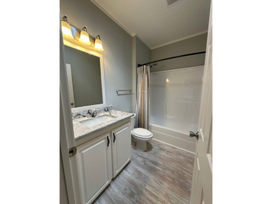 Located in the Foley Grove, a charming land-leased 55+ on Gulf Links Executive Golf Course in Alabama - for sale on GolfHomes.com, golf home, golf lot