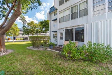 This charming 2-bedroom, 2-bathroom corner condo is in the on Oriole Golf and Tennis Club in Florida - for sale on GolfHomes.com, golf home, golf lot