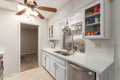 Enjoy comfortable and low-maintenance living in this delightful on Sun City Lakes West and East in Arizona - for sale on GolfHomes.com, golf home, golf lot