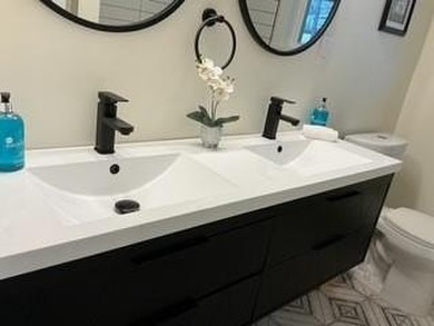 Welcome home! This beautifully remodeled 3-bedroom, 2 bath home on East Lake Golf Club in Georgia - for sale on GolfHomes.com, golf home, golf lot