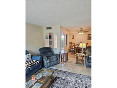 NOT in a 55+ community, this charming updated 2 bedroom, 2 bath on Bayou Golf Club in Florida - for sale on GolfHomes.com, golf home, golf lot