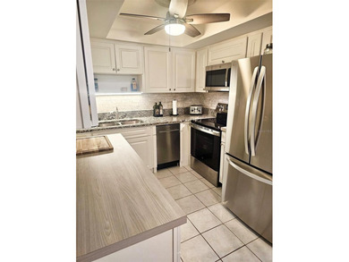 NOT in a 55+ community, this charming updated 2 bedroom, 2 bath on Bayou Golf Club in Florida - for sale on GolfHomes.com, golf home, golf lot