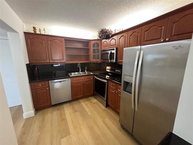 Top floor, corner unit.. Enclosed balcony with brand new Impact on Boca Dunes Golf and Country Club in Florida - for sale on GolfHomes.com, golf home, golf lot