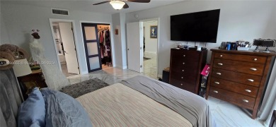 An updated 2 bed/2 bath with serene water/golf course views on Turnberry Isle Resort and Club in Florida - for sale on GolfHomes.com, golf home, golf lot