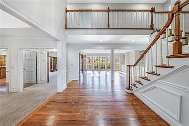 Welcome to a perfectly situated home in the heart of Windward on The Golf Club of Georgia in Georgia - for sale on GolfHomes.com, golf home, golf lot