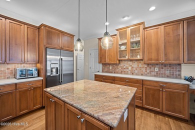 Step into this stunning Zaytoun-Raines custom home and you'll be on Cypress Landing Golf Club in North Carolina - for sale on GolfHomes.com, golf home, golf lot