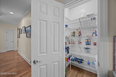 Step into this stunning Zaytoun-Raines custom home and you'll be on Cypress Landing Golf Club in North Carolina - for sale on GolfHomes.com, golf home, golf lot