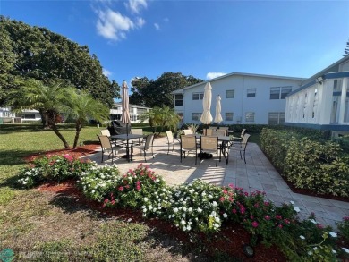 CUTE AS A BUTTON! CHARMING SECOND FLOOR 1 BEDROOM, 1 BATH CONDO on Hillsboro Pines Golf in Florida - for sale on GolfHomes.com, golf home, golf lot