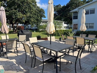 CUTE AS A BUTTON! CHARMING SECOND FLOOR 1 BEDROOM, 1 BATH CONDO on Hillsboro Pines Golf in Florida - for sale on GolfHomes.com, golf home, golf lot