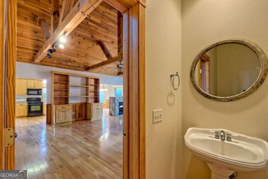 Breathtaking views abound from this 3-bedroom, 3.5-bath home on on Chatuge Shores Golf Course in North Carolina - for sale on GolfHomes.com, golf home, golf lot