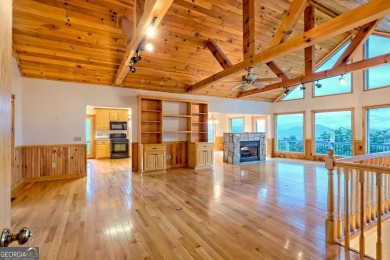 Breathtaking views abound from this 3-bedroom, 3.5-bath home on on Chatuge Shores Golf Course in North Carolina - for sale on GolfHomes.com, golf home, golf lot