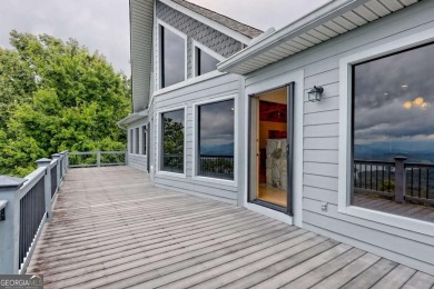 Breathtaking views abound from this 3-bedroom, 3.5-bath home on on Chatuge Shores Golf Course in North Carolina - for sale on GolfHomes.com, golf home, golf lot