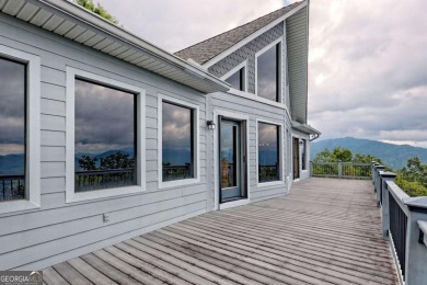Breathtaking views abound from this 3-bedroom, 3.5-bath home on on Chatuge Shores Golf Course in North Carolina - for sale on GolfHomes.com, golf home, golf lot