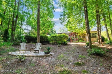 Step into this stunning Zaytoun-Raines custom home and you'll be on Cypress Landing Golf Club in North Carolina - for sale on GolfHomes.com, golf home, golf lot