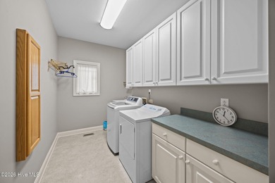 Step into this stunning Zaytoun-Raines custom home and you'll be on Cypress Landing Golf Club in North Carolina - for sale on GolfHomes.com, golf home, golf lot