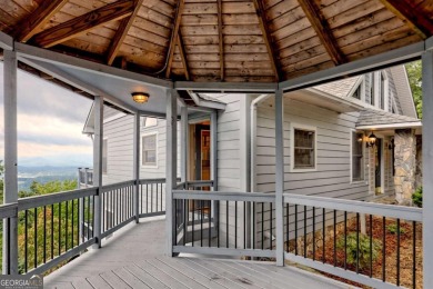 Breathtaking views abound from this 3-bedroom, 3.5-bath home on on Chatuge Shores Golf Course in North Carolina - for sale on GolfHomes.com, golf home, golf lot