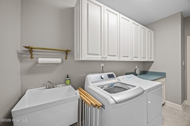 Step into this stunning Zaytoun-Raines custom home and you'll be on Cypress Landing Golf Club in North Carolina - for sale on GolfHomes.com, golf home, golf lot