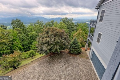 Breathtaking views abound from this 3-bedroom, 3.5-bath home on on Chatuge Shores Golf Course in North Carolina - for sale on GolfHomes.com, golf home, golf lot