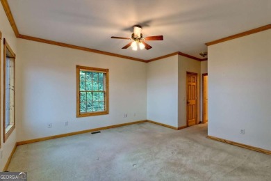 Breathtaking views abound from this 3-bedroom, 3.5-bath home on on Chatuge Shores Golf Course in North Carolina - for sale on GolfHomes.com, golf home, golf lot