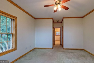 Breathtaking views abound from this 3-bedroom, 3.5-bath home on on Chatuge Shores Golf Course in North Carolina - for sale on GolfHomes.com, golf home, golf lot