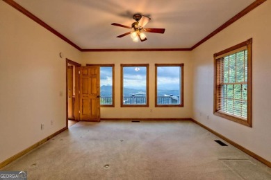 Breathtaking views abound from this 3-bedroom, 3.5-bath home on on Chatuge Shores Golf Course in North Carolina - for sale on GolfHomes.com, golf home, golf lot