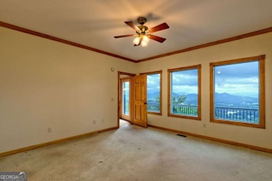 Breathtaking views abound from this 3-bedroom, 3.5-bath home on on Chatuge Shores Golf Course in North Carolina - for sale on GolfHomes.com, golf home, golf lot