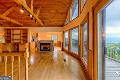 Breathtaking views abound from this 3-bedroom, 3.5-bath home on on Chatuge Shores Golf Course in North Carolina - for sale on GolfHomes.com, golf home, golf lot