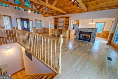 Breathtaking views abound from this 3-bedroom, 3.5-bath home on on Chatuge Shores Golf Course in North Carolina - for sale on GolfHomes.com, golf home, golf lot