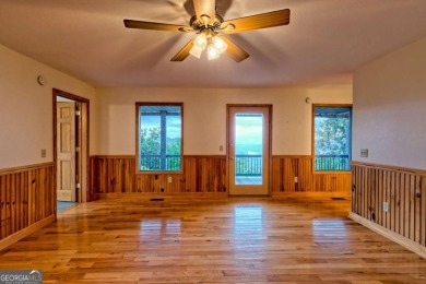Breathtaking views abound from this 3-bedroom, 3.5-bath home on on Chatuge Shores Golf Course in North Carolina - for sale on GolfHomes.com, golf home, golf lot