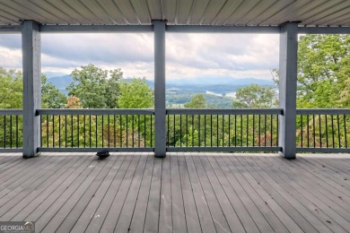 Breathtaking views abound from this 3-bedroom, 3.5-bath home on on Chatuge Shores Golf Course in North Carolina - for sale on GolfHomes.com, golf home, golf lot
