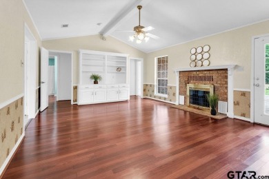 Set on a beautifully landscaped, oversized, 1 plus acre lot on Hide-A-Way Lake Golf Course in Texas - for sale on GolfHomes.com, golf home, golf lot