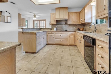 Set on a beautifully landscaped, oversized, 1 plus acre lot on Hide-A-Way Lake Golf Course in Texas - for sale on GolfHomes.com, golf home, golf lot