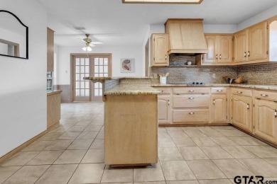 Set on a beautifully landscaped, oversized, 1 plus acre lot on Hide-A-Way Lake Golf Course in Texas - for sale on GolfHomes.com, golf home, golf lot