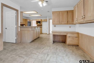 Set on a beautifully landscaped, oversized, 1 plus acre lot on Hide-A-Way Lake Golf Course in Texas - for sale on GolfHomes.com, golf home, golf lot