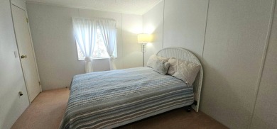 This fully furnished 1995 2-bed, 2-bath waterfront home in the on The Club At Pointe West in Florida - for sale on GolfHomes.com, golf home, golf lot