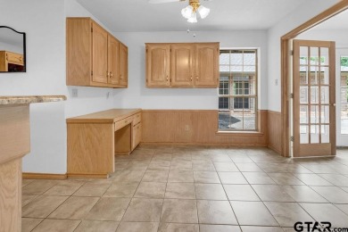 Set on a beautifully landscaped, oversized, 1 plus acre lot on Hide-A-Way Lake Golf Course in Texas - for sale on GolfHomes.com, golf home, golf lot