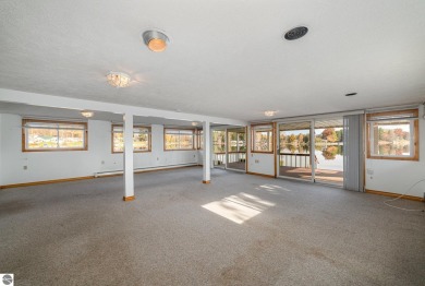 Lakefront home with 2 bedrooms, 3 full bathrooms, and over 2600 on Eagle Glen Golf Course in Michigan - for sale on GolfHomes.com, golf home, golf lot