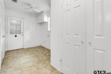 Set on a beautifully landscaped, oversized, 1 plus acre lot on Hide-A-Way Lake Golf Course in Texas - for sale on GolfHomes.com, golf home, golf lot