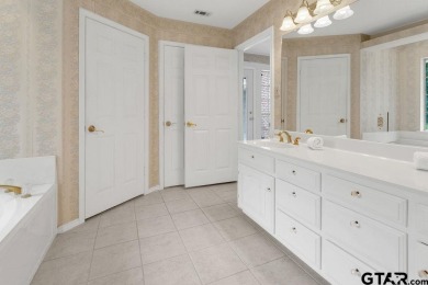 Set on a beautifully landscaped, oversized, 1 plus acre lot on Hide-A-Way Lake Golf Course in Texas - for sale on GolfHomes.com, golf home, golf lot