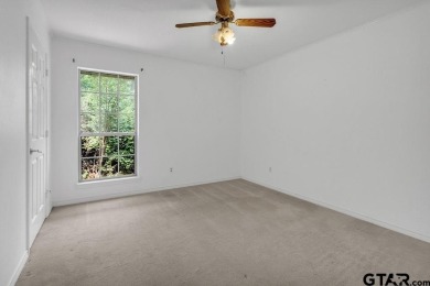 Set on a beautifully landscaped, oversized, 1 plus acre lot on Hide-A-Way Lake Golf Course in Texas - for sale on GolfHomes.com, golf home, golf lot