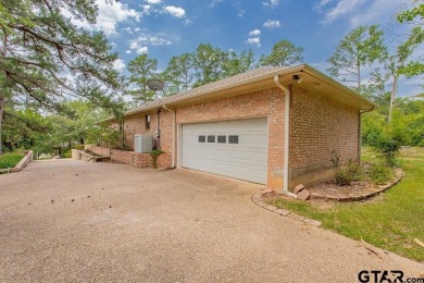 Set on a beautifully landscaped, oversized, 1 plus acre lot on Hide-A-Way Lake Golf Course in Texas - for sale on GolfHomes.com, golf home, golf lot