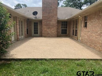 Set on a beautifully landscaped, oversized, 1 plus acre lot on Hide-A-Way Lake Golf Course in Texas - for sale on GolfHomes.com, golf home, golf lot