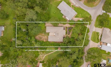 Set on a beautifully landscaped, oversized, 1 plus acre lot on Hide-A-Way Lake Golf Course in Texas - for sale on GolfHomes.com, golf home, golf lot