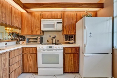 This 2 bedroom 2 bathroom 4th floor condo overlooking the golf on Pine Island Ridge Country Club in Florida - for sale on GolfHomes.com, golf home, golf lot