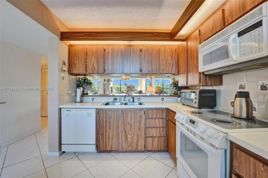 This 2 bedroom 2 bathroom 4th floor condo overlooking the golf on Pine Island Ridge Country Club in Florida - for sale on GolfHomes.com, golf home, golf lot