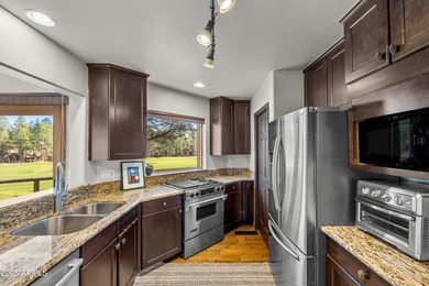 Escape to this pristine and well-cared-for cabin nestled among on Forest Highlands Golf Club - The Canyon in Arizona - for sale on GolfHomes.com, golf home, golf lot