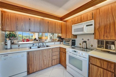 This 2 bedroom 2 bathroom 4th floor condo overlooking the golf on Pine Island Ridge Country Club in Florida - for sale on GolfHomes.com, golf home, golf lot