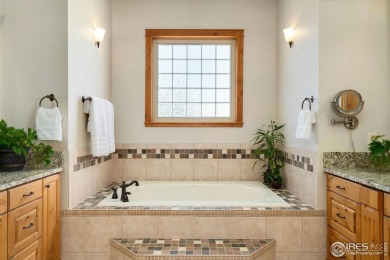 Located in Highland Hills, this exquisite property is nestled on Ptarmigan Golf Course in Colorado - for sale on GolfHomes.com, golf home, golf lot