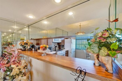 This 2 bedroom 2 bathroom 4th floor condo overlooking the golf on Pine Island Ridge Country Club in Florida - for sale on GolfHomes.com, golf home, golf lot